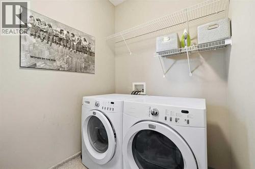 65 Elgin Meadows Circle Se, Calgary, AB - Indoor Photo Showing Laundry Room