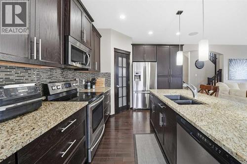 65 Elgin Meadows Circle Se, Calgary, AB - Indoor Photo Showing Kitchen With Stainless Steel Kitchen With Double Sink With Upgraded Kitchen