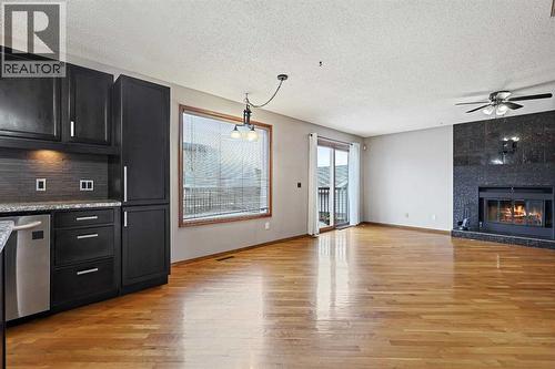 128 Ventura Way Ne, Calgary, AB - Indoor Photo Showing Kitchen With Fireplace