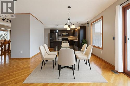 virtually staged - 128 Ventura Way Ne, Calgary, AB - Indoor Photo Showing Dining Room