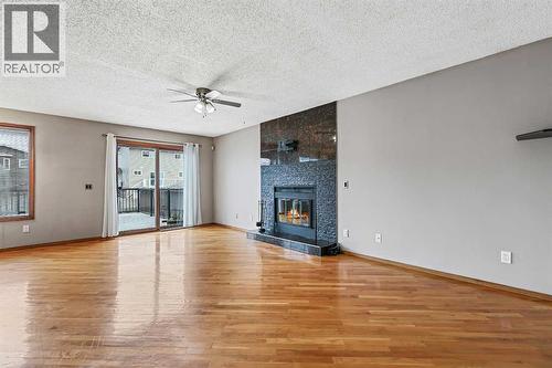 128 Ventura Way Ne, Calgary, AB - Indoor Photo Showing Living Room With Fireplace