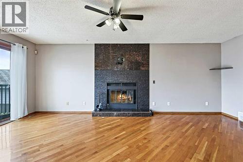 128 Ventura Way Ne, Calgary, AB - Indoor Photo Showing Living Room With Fireplace