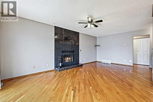 128 Ventura Way Ne, Calgary, AB - Indoor Photo Showing Living Room With Fireplace