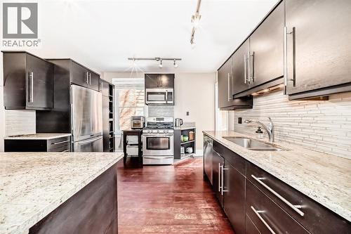 2125 36 Avenue Sw, Calgary, AB - Indoor Photo Showing Kitchen With Double Sink With Upgraded Kitchen