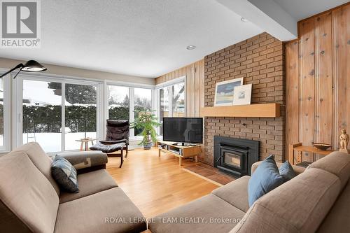 9 Woodthrush Green, Ottawa, ON - Indoor Photo Showing Living Room With Fireplace