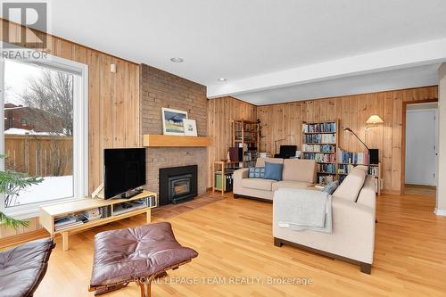 9 Woodthrush Green, Ottawa, ON - Indoor Photo Showing Living Room With Fireplace