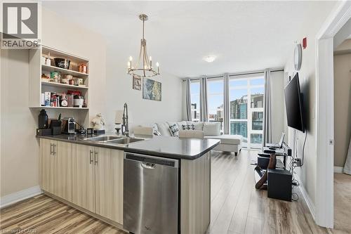 10 Concord Place Unit# 205, Grimsby, ON - Indoor Photo Showing Kitchen With Double Sink