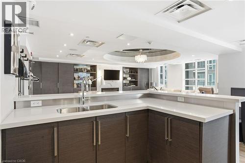 10 Concord Place Unit# 205, Grimsby, ON - Indoor Photo Showing Kitchen With Double Sink