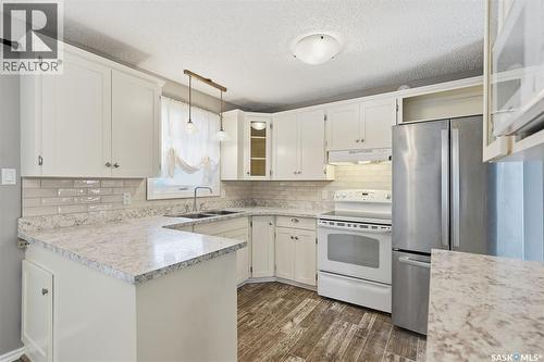 3441 12Th Avenue E, Prince Albert, SK - Indoor Photo Showing Kitchen With Double Sink