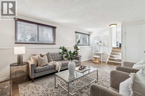 195 Lake Adams Crescent Se, Calgary, AB - Indoor Photo Showing Living Room