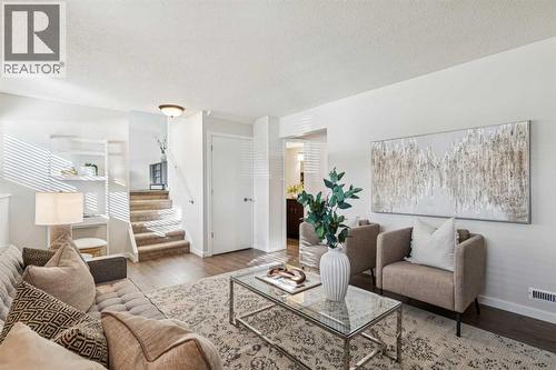 195 Lake Adams Crescent Se, Calgary, AB - Indoor Photo Showing Living Room