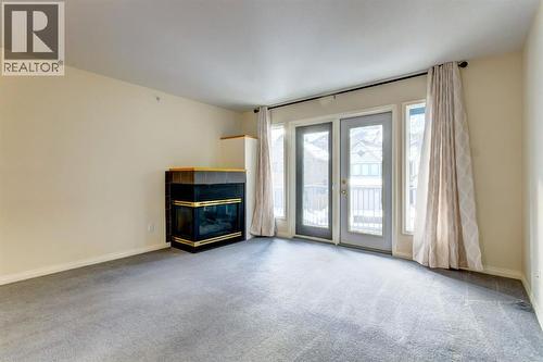 4, 704 8Th Avenue, Canmore, AB - Indoor With Fireplace