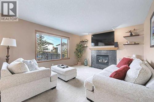105 Citadel Crest Park Nw, Calgary, AB - Indoor Photo Showing Living Room With Fireplace