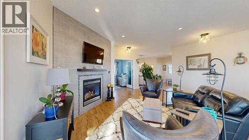 4020 Monarch Way, Stettler, AB - Indoor Photo Showing Living Room With Fireplace