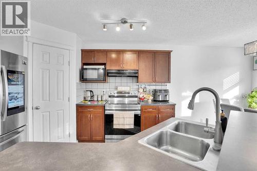 73 Covebrook Place Ne, Calgary, AB - Indoor Photo Showing Kitchen With Double Sink