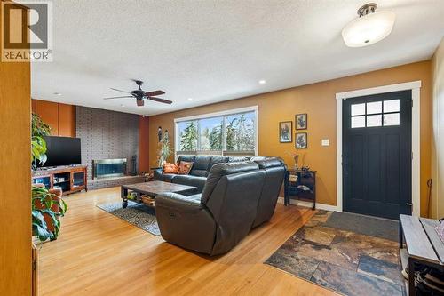 1507 Cayuga Drive Nw, Calgary, AB - Indoor Photo Showing Living Room With Fireplace