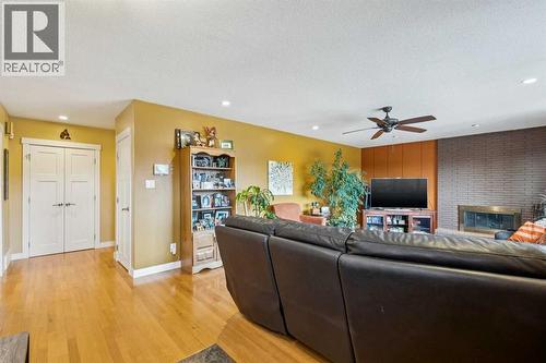 1507 Cayuga Drive Nw, Calgary, AB - Indoor Photo Showing Living Room With Fireplace