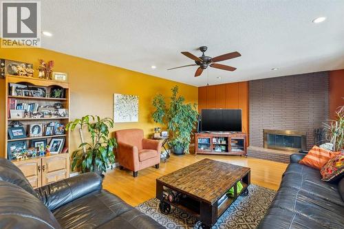 1507 Cayuga Drive Nw, Calgary, AB - Indoor Photo Showing Living Room With Fireplace
