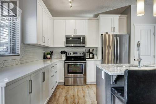 444 Legacy Point Se, Calgary, AB - Indoor Photo Showing Kitchen With Double Sink With Upgraded Kitchen