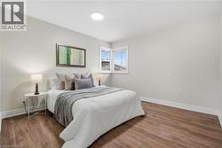 Bedroom with wood finished floors - 