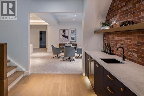 Brick Feature Wall Wet Bar with Underlit Shelving - 2920 Toronto Crescent Nw, Calgary, AB - Indoor Photo Showing Kitchen