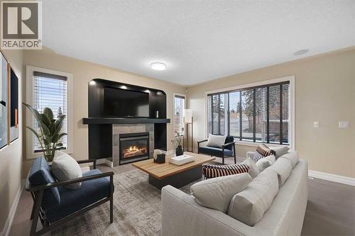 5619 Coach Hill Road Sw, Calgary, AB - Indoor Photo Showing Living Room With Fireplace