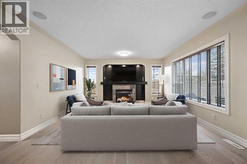 5619 Coach Hill Road Sw, Calgary, AB - Indoor Photo Showing Living Room With Fireplace