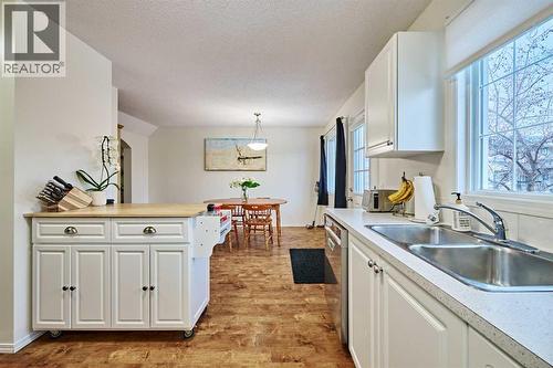 2366 Eversyde Avenue Sw, Calgary, AB - Indoor Photo Showing Kitchen With Double Sink