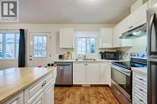 2366 Eversyde Avenue Sw, Calgary, AB - Indoor Photo Showing Kitchen With Double Sink