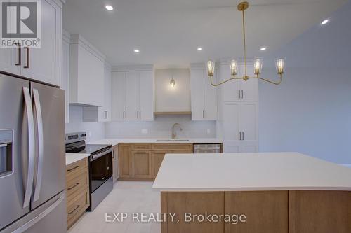 93 Bedell Drive, Mapleton, ON - Indoor Photo Showing Kitchen With Upgraded Kitchen