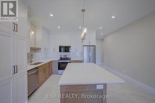 93 Bedell Drive, Mapleton, ON - Indoor Photo Showing Kitchen With Stainless Steel Kitchen With Upgraded Kitchen