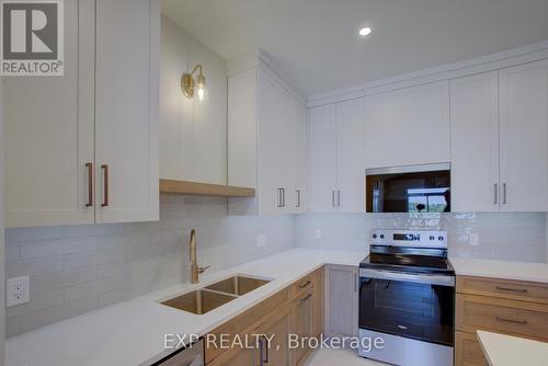 93 Bedell Drive, Mapleton, ON - Indoor Photo Showing Kitchen With Stainless Steel Kitchen With Double Sink With Upgraded Kitchen