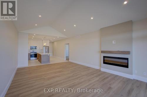 93 Bedell Drive, Mapleton, ON - Indoor Photo Showing Living Room With Fireplace