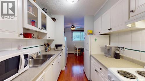 27 111 St Lawrence Crescent, Saskatoon, SK - Indoor Photo Showing Kitchen With Double Sink