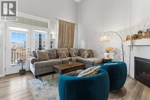 237 Windrow Crescent Sw, Airdrie, AB - Indoor Photo Showing Living Room With Fireplace