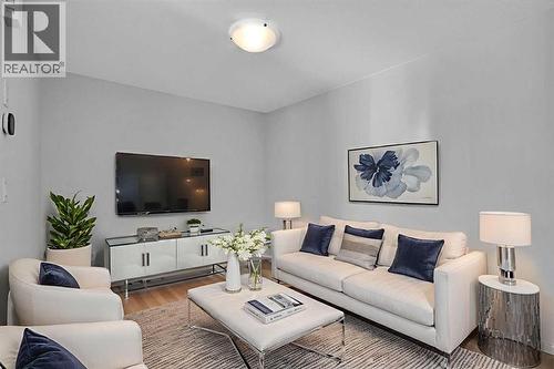 Virtually Staged Living Room - 408 Windbury Link Sw, Airdrie, AB - Indoor Photo Showing Living Room