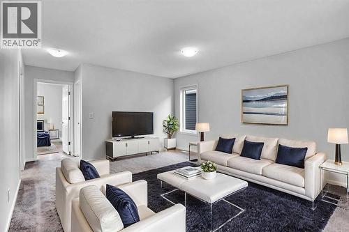 Virtually Staged Bonus room - 408 Windbury Link Sw, Airdrie, AB - Indoor Photo Showing Living Room