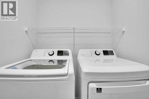 Laundry Room - 408 Windbury Link Sw, Airdrie, AB - Indoor Photo Showing Laundry Room