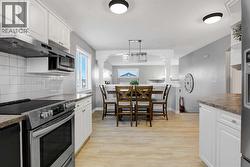 DINING AREA OPEN TO LIVING ROOM - 