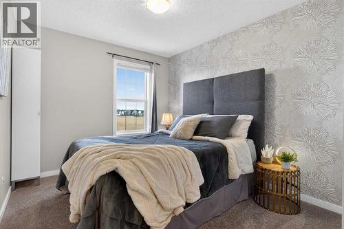 Bedroom #2 - 317 Legacy Boulevard Se, Calgary, AB - Indoor Photo Showing Bedroom