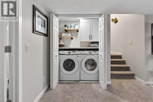 Lower Laundry Room with New Machines - 317 Legacy Boulevard Se, Calgary, AB - Indoor Photo Showing Laundry Room
