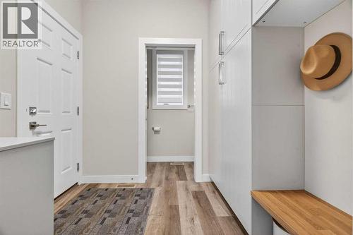 Mudroom off the garage with custom built-in cabinets and bench and storage - 307 Precedence Hill, Cochrane, AB - Indoor Photo Showing Other Room