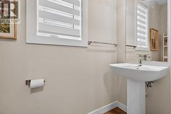 Bright 2-piece powder room off of the mudroom - 