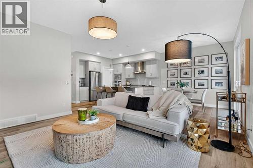 A cozy and warm living room blends functionality with design - 307 Precedence Hill, Cochrane, AB - Indoor Photo Showing Living Room