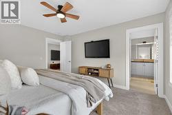 Beautiful and warm primary bedroom that fits a king bed and two large side tables - 