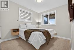 4th bedroom in the basement with two large windows and double door closet - 