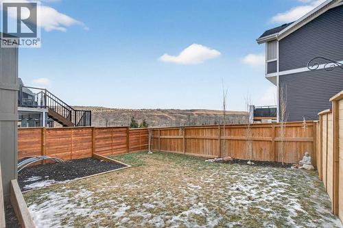 Fully landscaped backyard with fresh sod, new fence, and mulch gardens - 307 Precedence Hill, Cochrane, AB - Outdoor