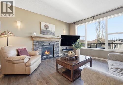 166 Cranridge Terrace Se, Calgary, AB - Indoor Photo Showing Living Room With Fireplace