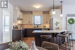 CUSTOM KITCHEN W/QUARTZ COUNTERS - 