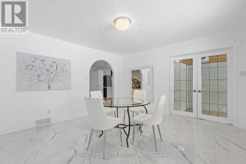 Access the screened in porch through those doors - 1444 Normandy Crescent, Ottawa, ON - Indoor Photo Showing Dining Room
